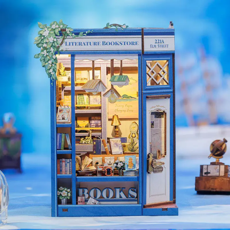 CuteBee BJAA203 Kit Book Nook Cutebee Literature Bookstore: puzzle 3D in legno con luci LED, miniatura di libreria fai-da-te per decorazione scaffali e fermalibri creativo. Vista frontale.